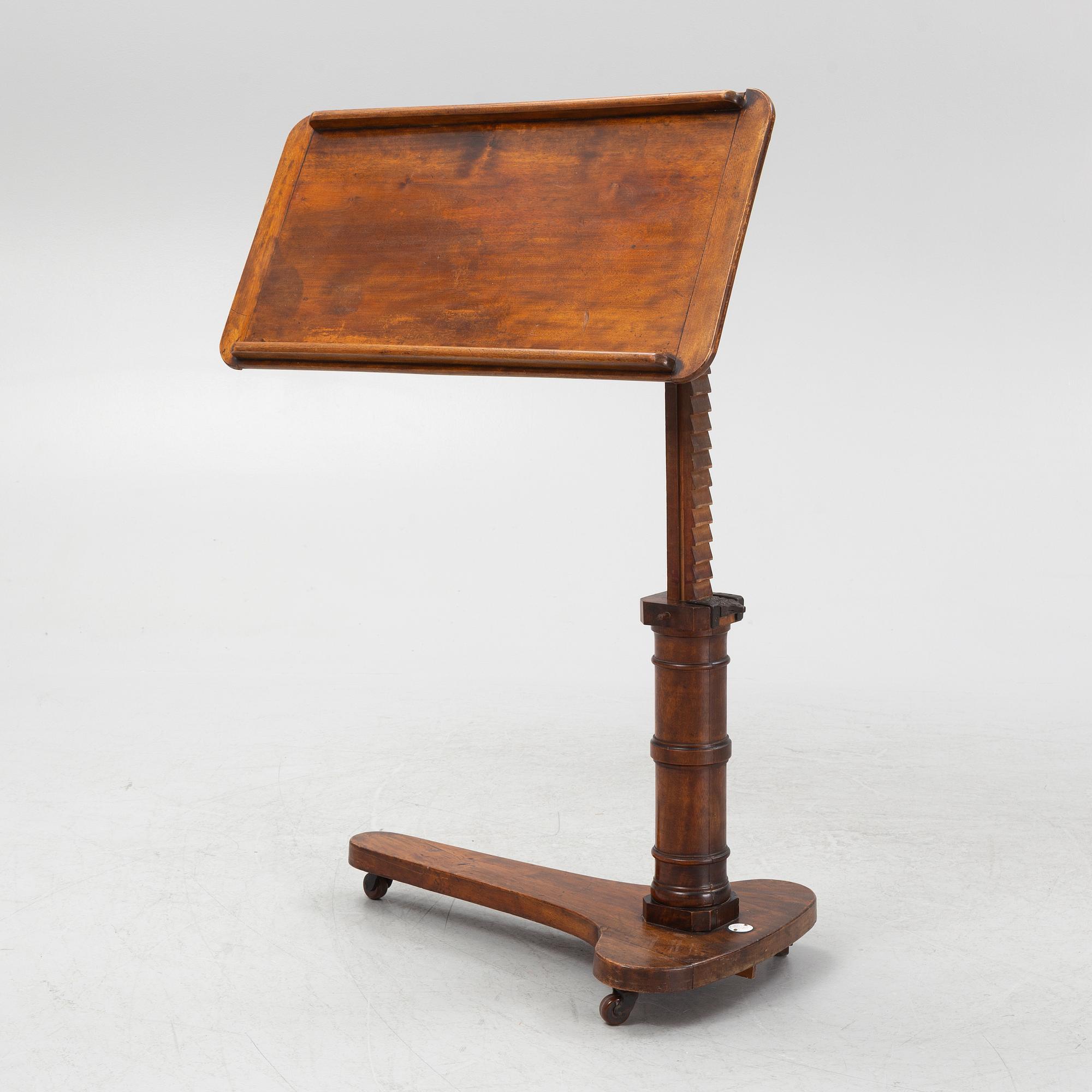 A reading table, J. Carter London, England, circa 1900.