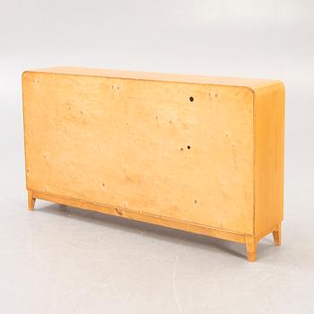 A 1940s birch book shelf.