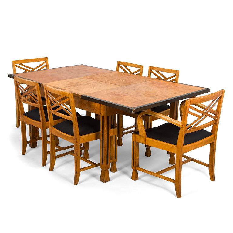 A 1920s/30s century dining table and set of 6 + 2 chairs.