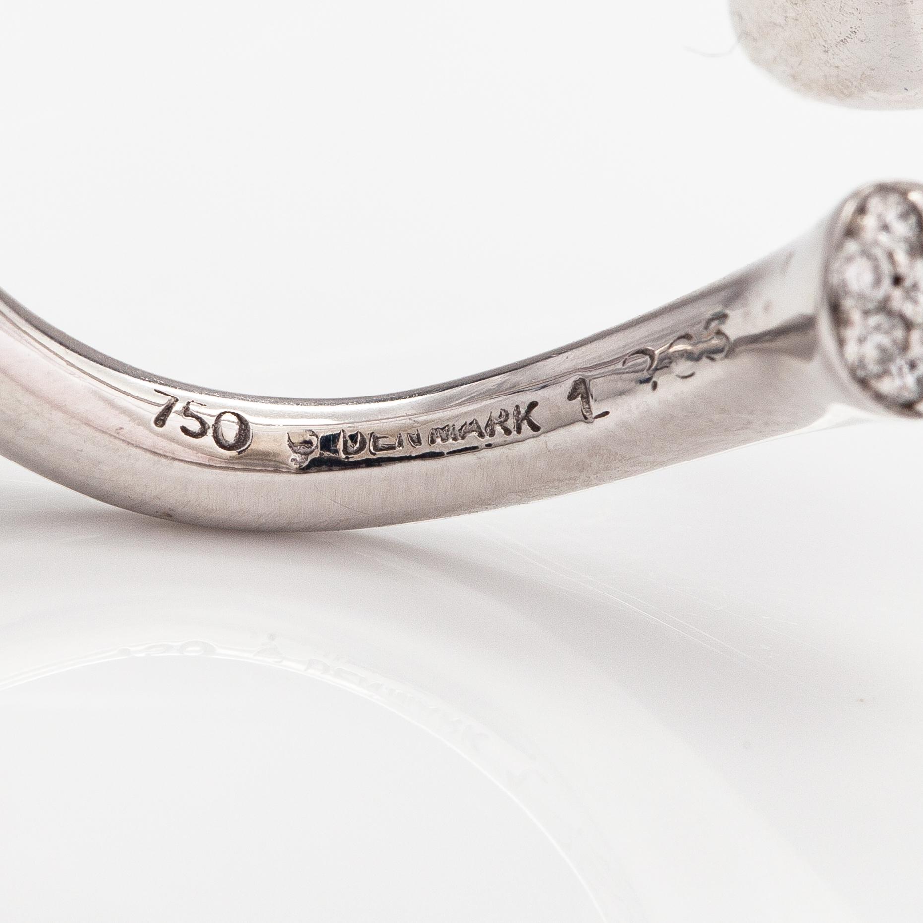 Georg Jensen "Carnival", an 18K white gold ring with a tourmaline and diamonds ca. 0.15 ct. Marked 1863. Denmark.