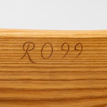 A solid pine stool, signed RO -99, Sweden.