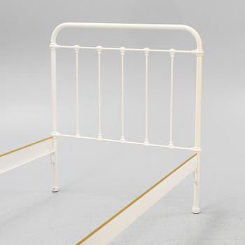 A pair of bed frames and bedside tables, second half of the 20th Century.