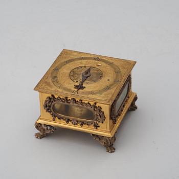 A Baroque 17th century traweller's clock in original case.