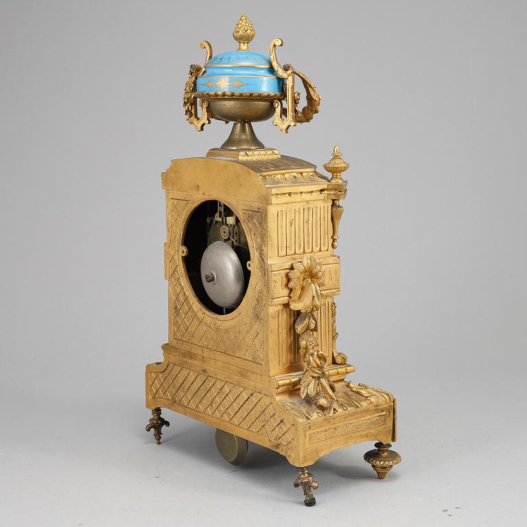A late 19th Century bronze and porelain mantel clock.
