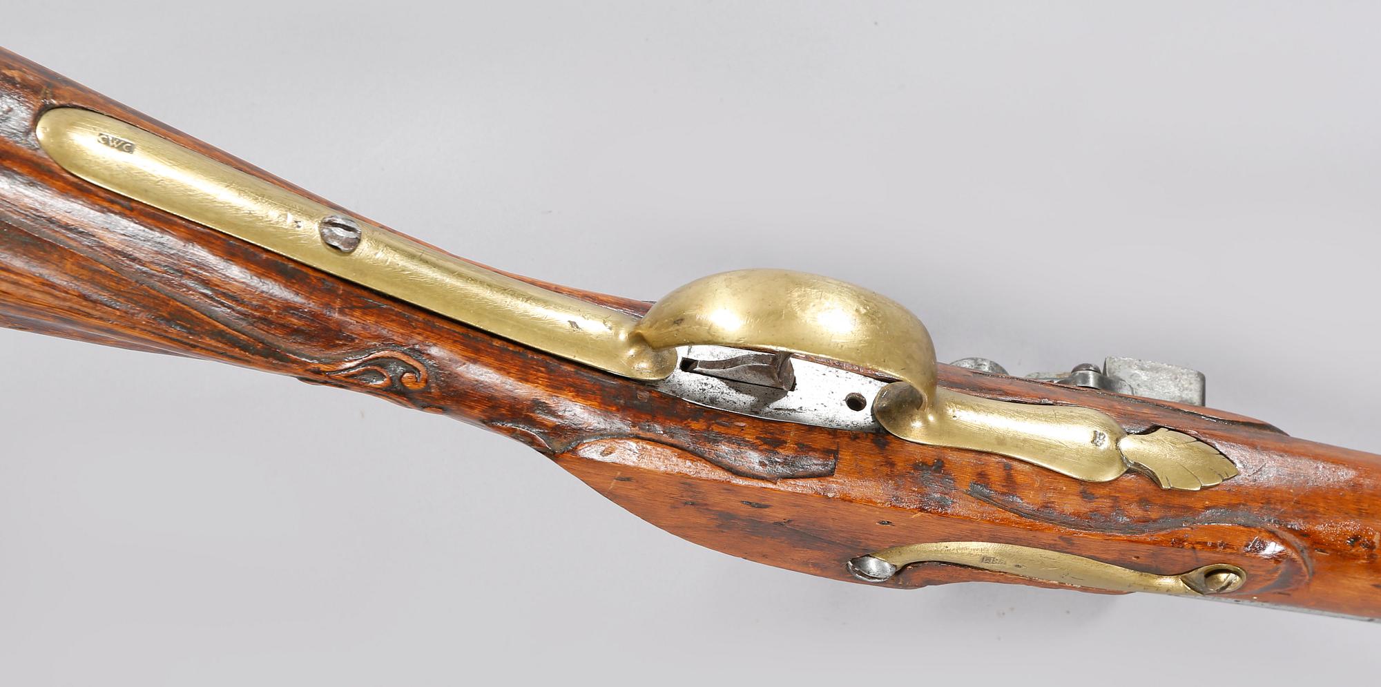 A flintlock rifle, 18th century.