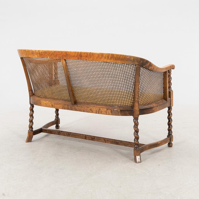 A 1920s rattan sofa.