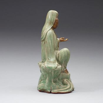 A seated celadon figure of Guanyin, presumably Longquan Ming dynasty, 17th Century.