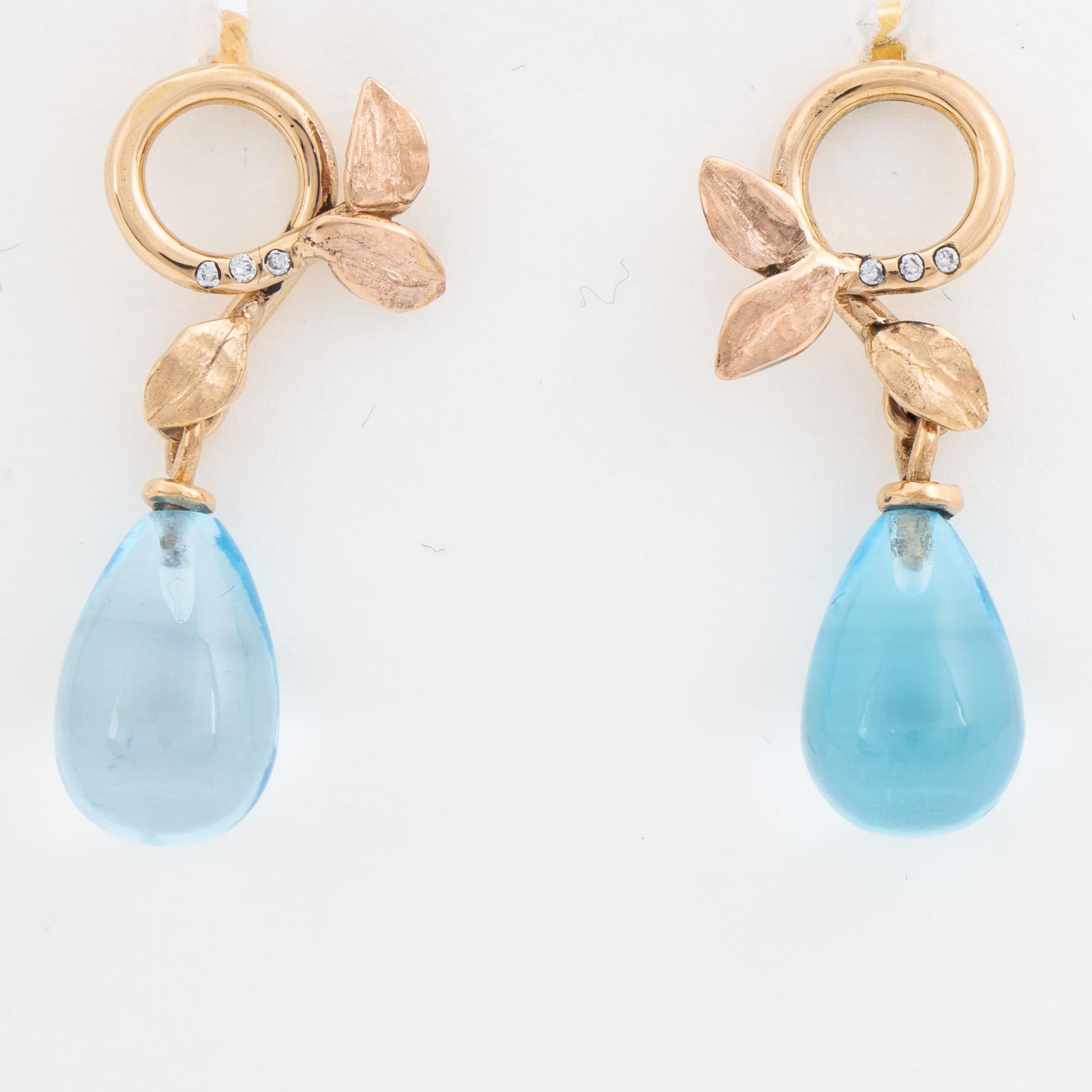 Blue topaz and brilliant-cut diamond earrings.