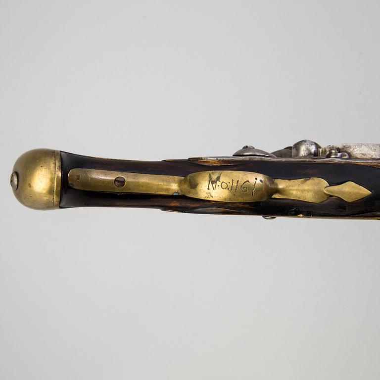 A 18th century flintlock pistol.