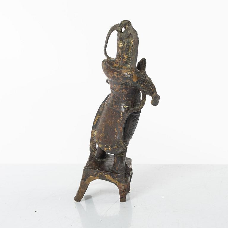 A Chinese bronze figure of a guardsman, Ming dynasty (1368-1644).