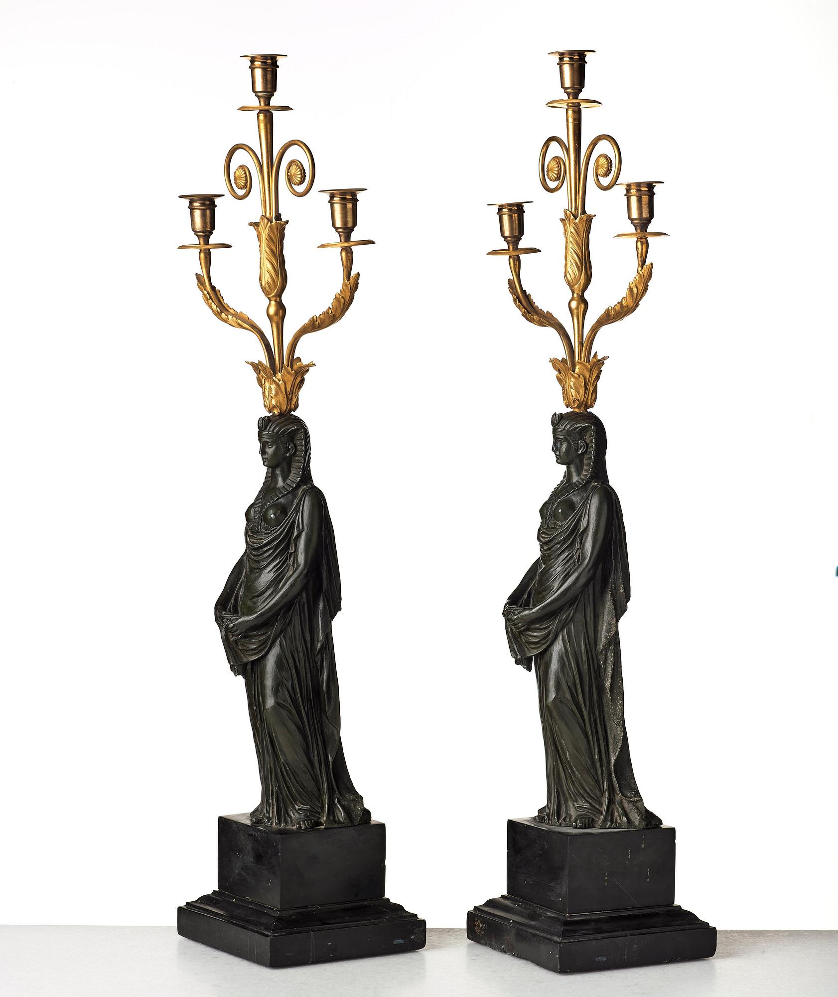 A pair of French Empire early 19th century three-light candelabra.