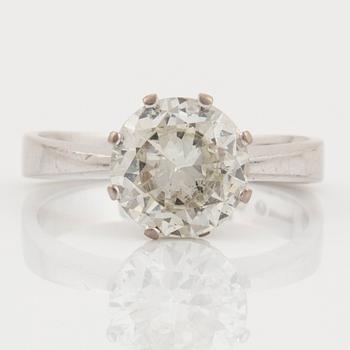 An 18K white gold ring set with an old-cut diamond.