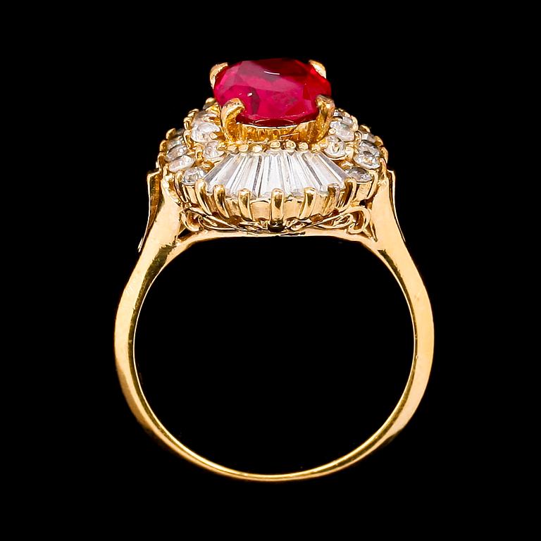 A 1970s golden ring with red decorative stone by Christian Dior.