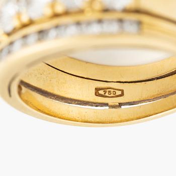 Ring 18K guld med runda briljantslipade diamanter.