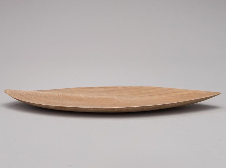 A 1950s plywood dish signed TW.