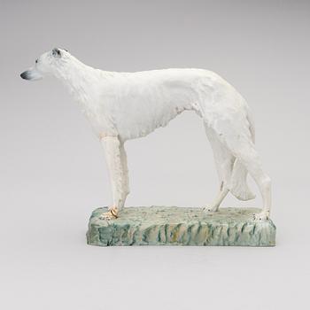 A porcelain borzoi figurine from Arabia Finland, signed and dated -30.