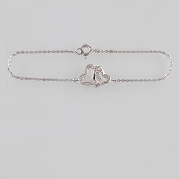 ARMBAND, 18K vitguld med briljantslipade diamanter ca 0.07 ct. Vikt 2,0 gram.