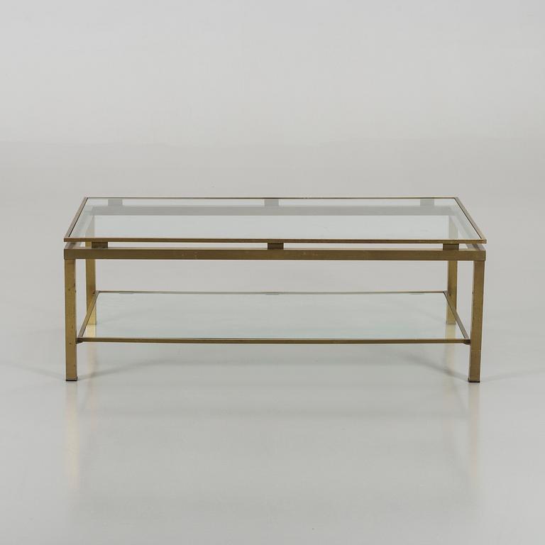 A BRASS GLASS TOP COFFEE TABLE.