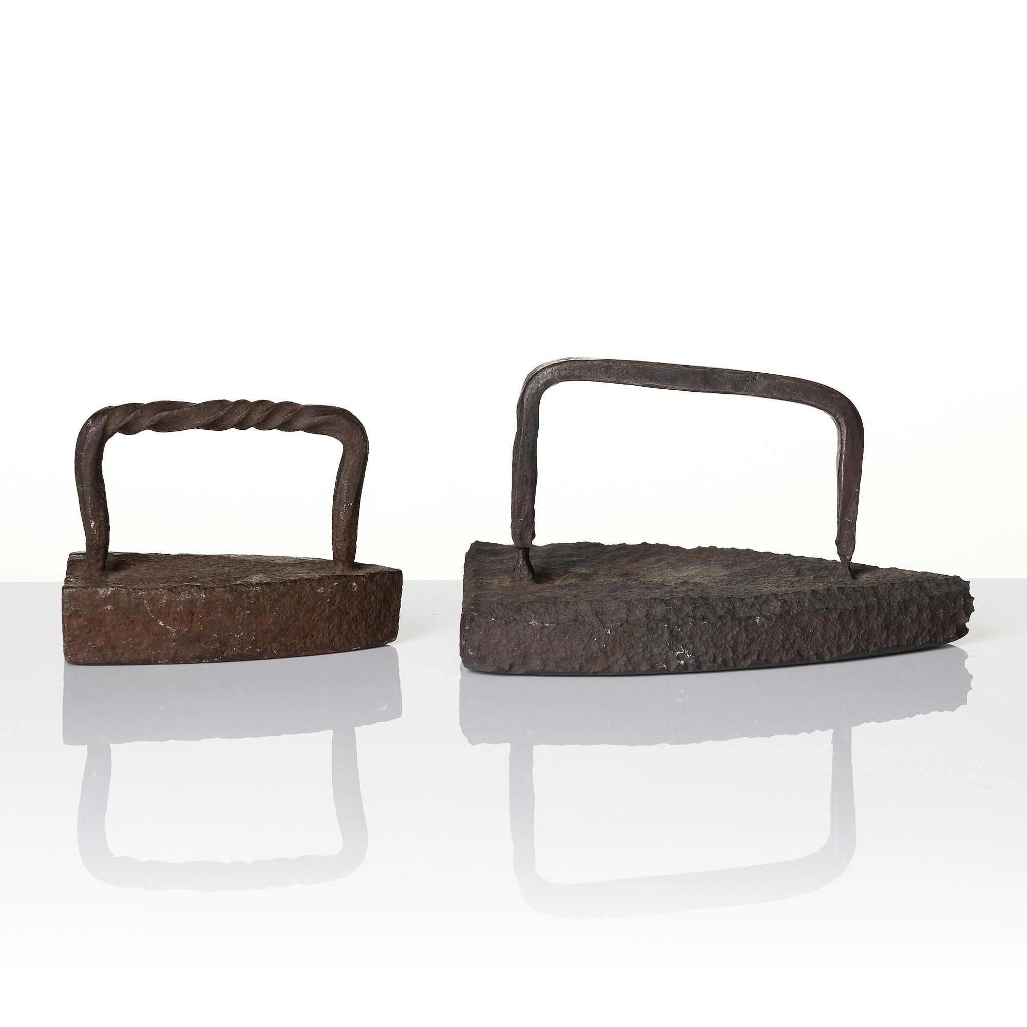 Two cast iron clothes irons, 18th / early 19th century.