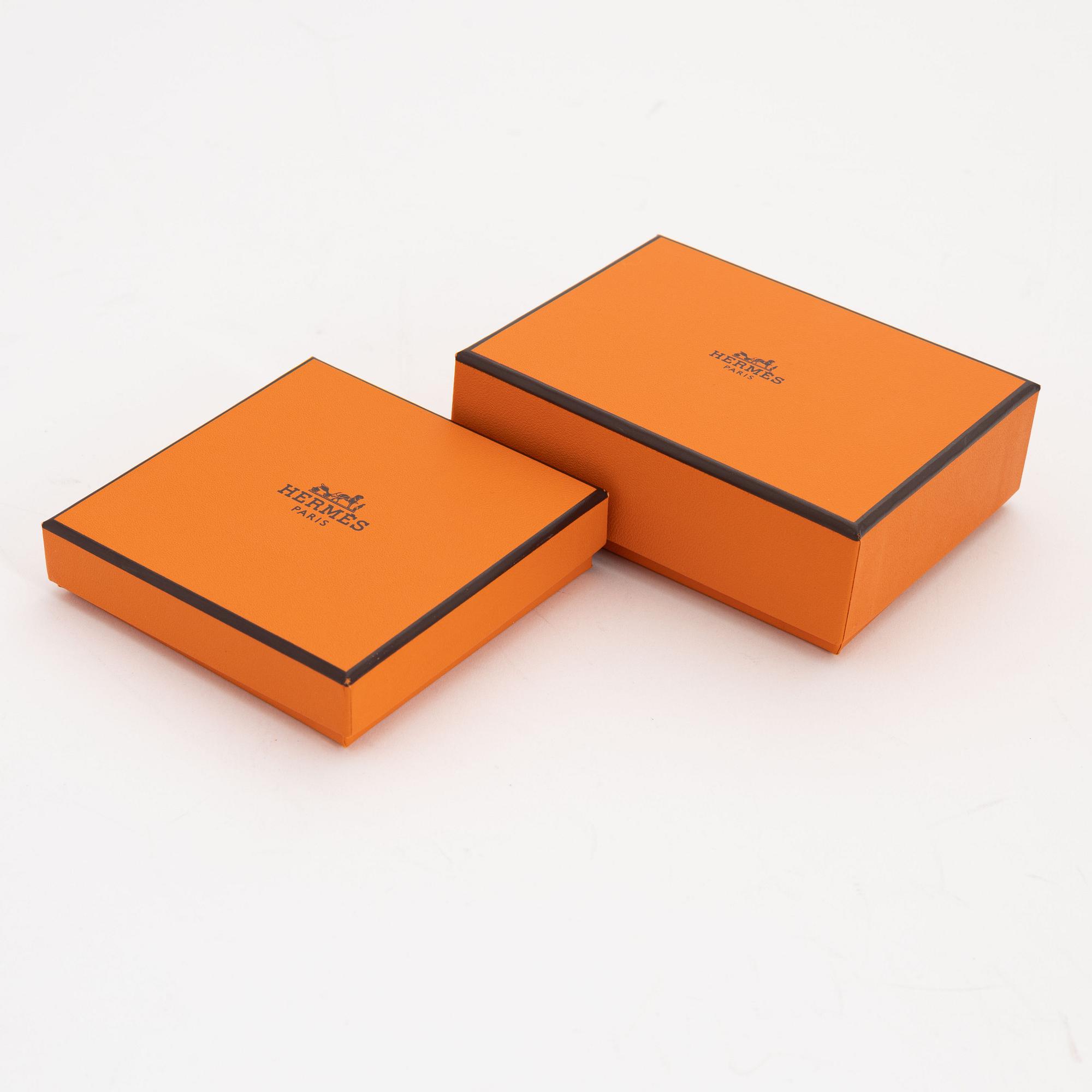 Hermès, a leather bracelet and key chain.