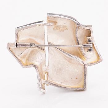 BJÖRN WECKSTRÖM, A sterling silver brooch "The stranger on Io". Lapponia 1974.