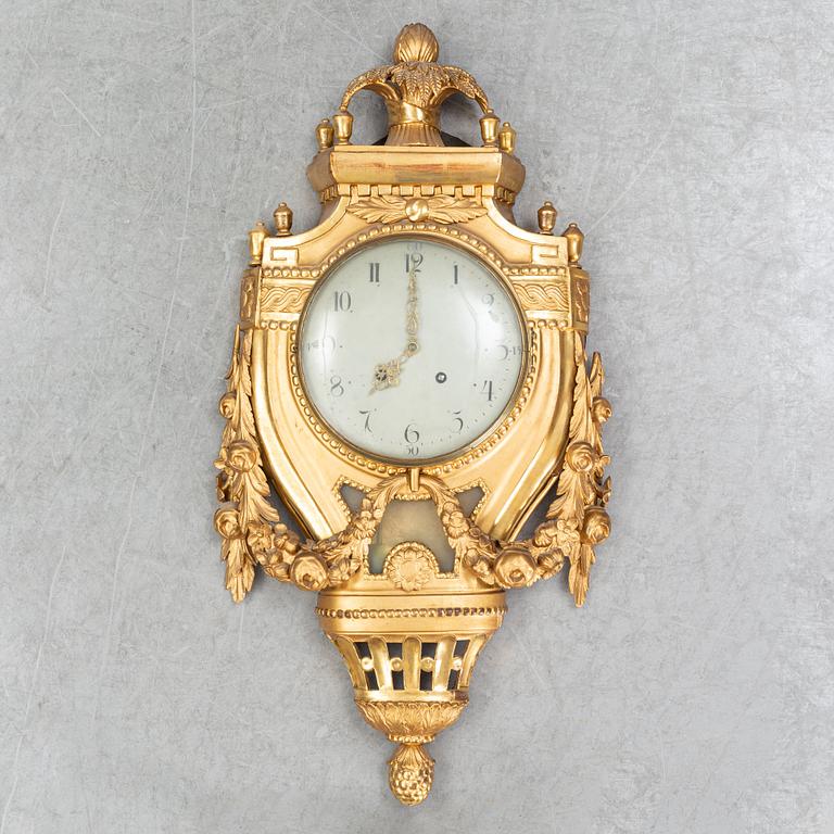 A Gustavian pendulum wall clock.