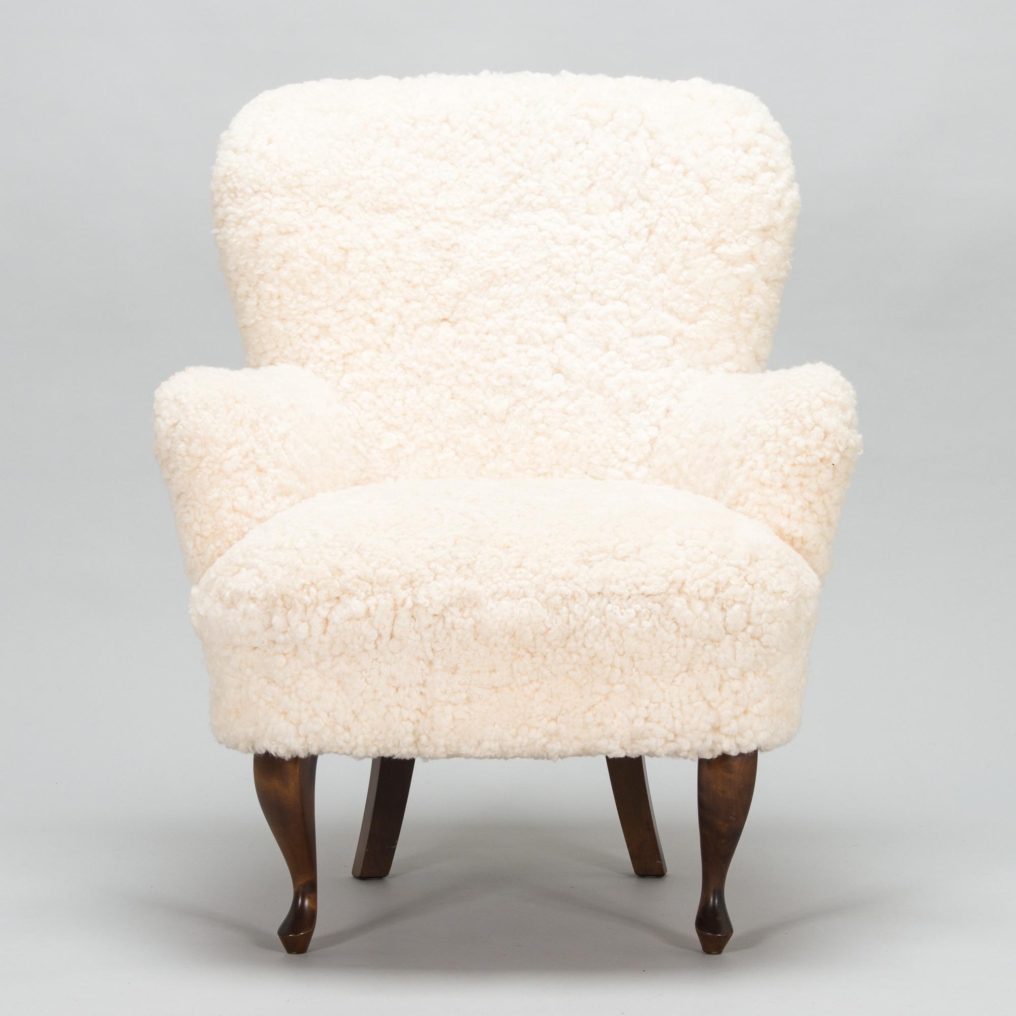 A contemporary sheepskin upholstered lounge chair, ABC collection.