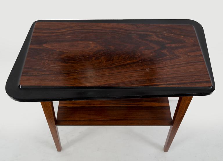 A second half of the 20th century rosewood mirror with table.