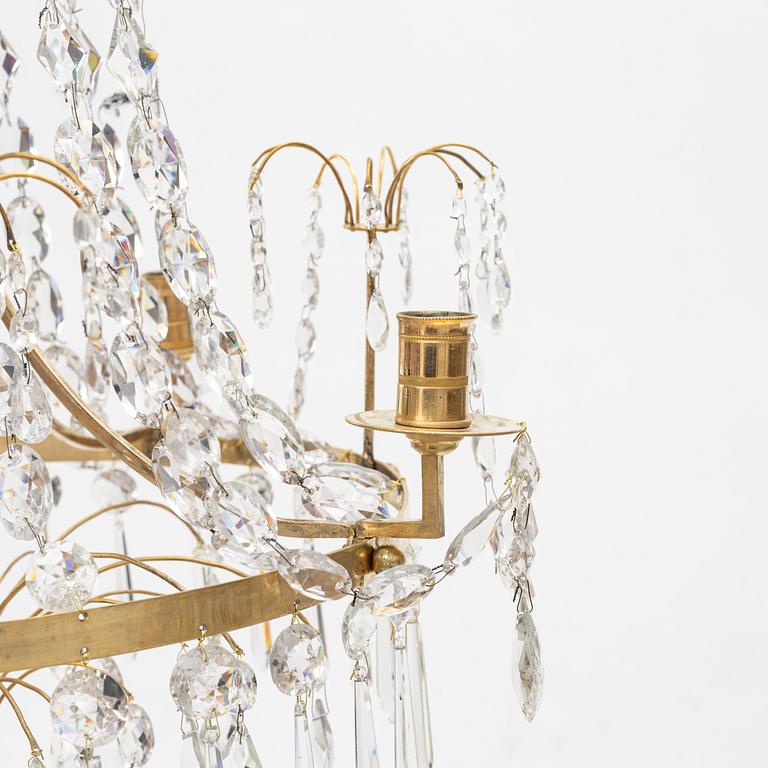 A Gustavian four-branch gilt-brass chandelier, Stockholm, late 18th century.