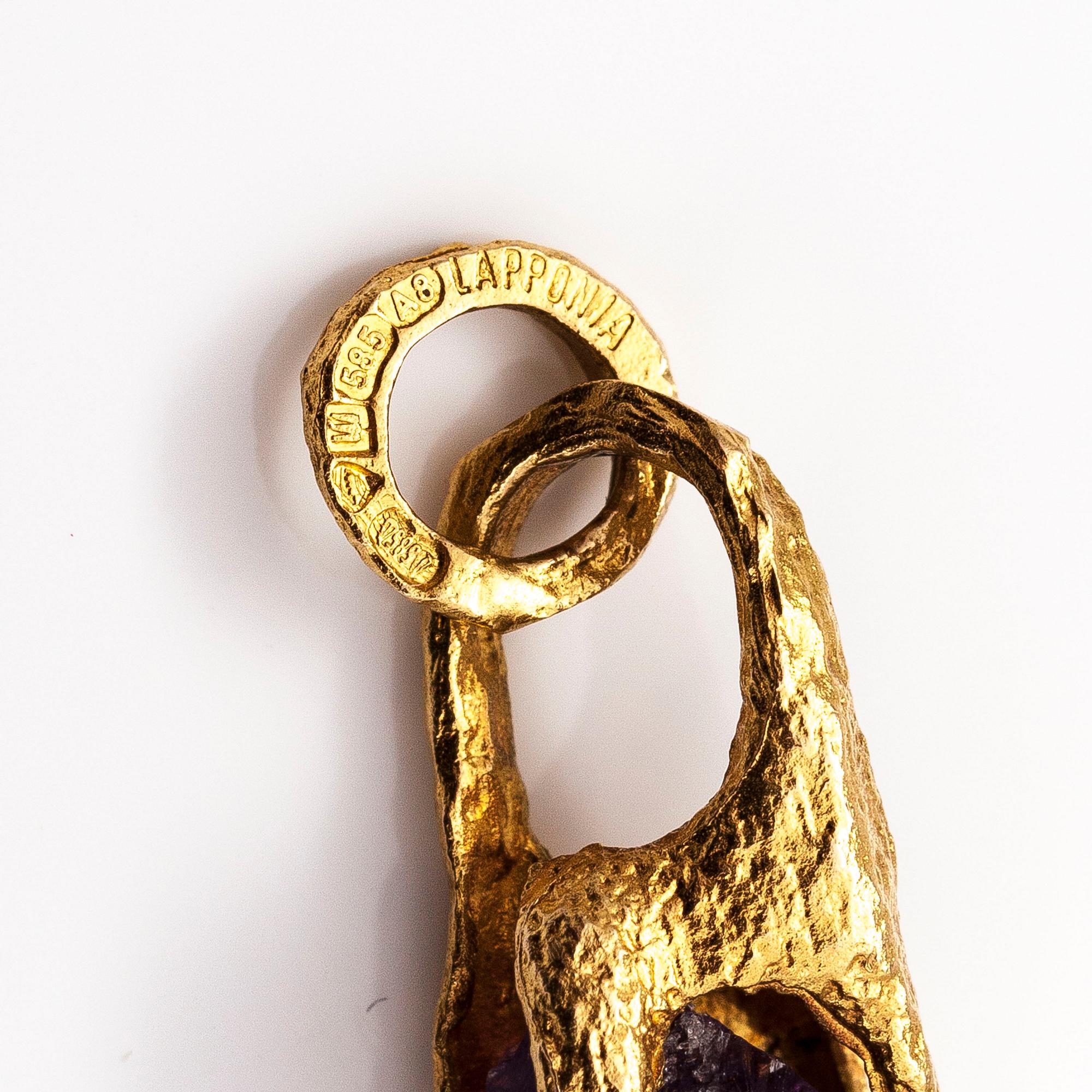 BJÖRN WECKSTRÖM, A 14K gold pendant "Reindeer clock" with an amethyst and chain "Raito". Lapponia 1978  and 1982.