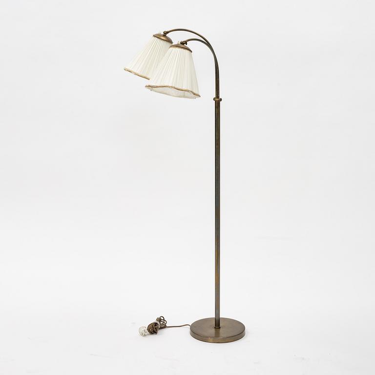 A brass floor lamp, mid 20th Century.