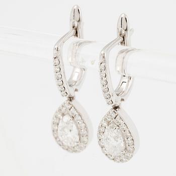 Earrings, a pair, 18K white gold set with pear-shaped and brilliant-cut diamonds.