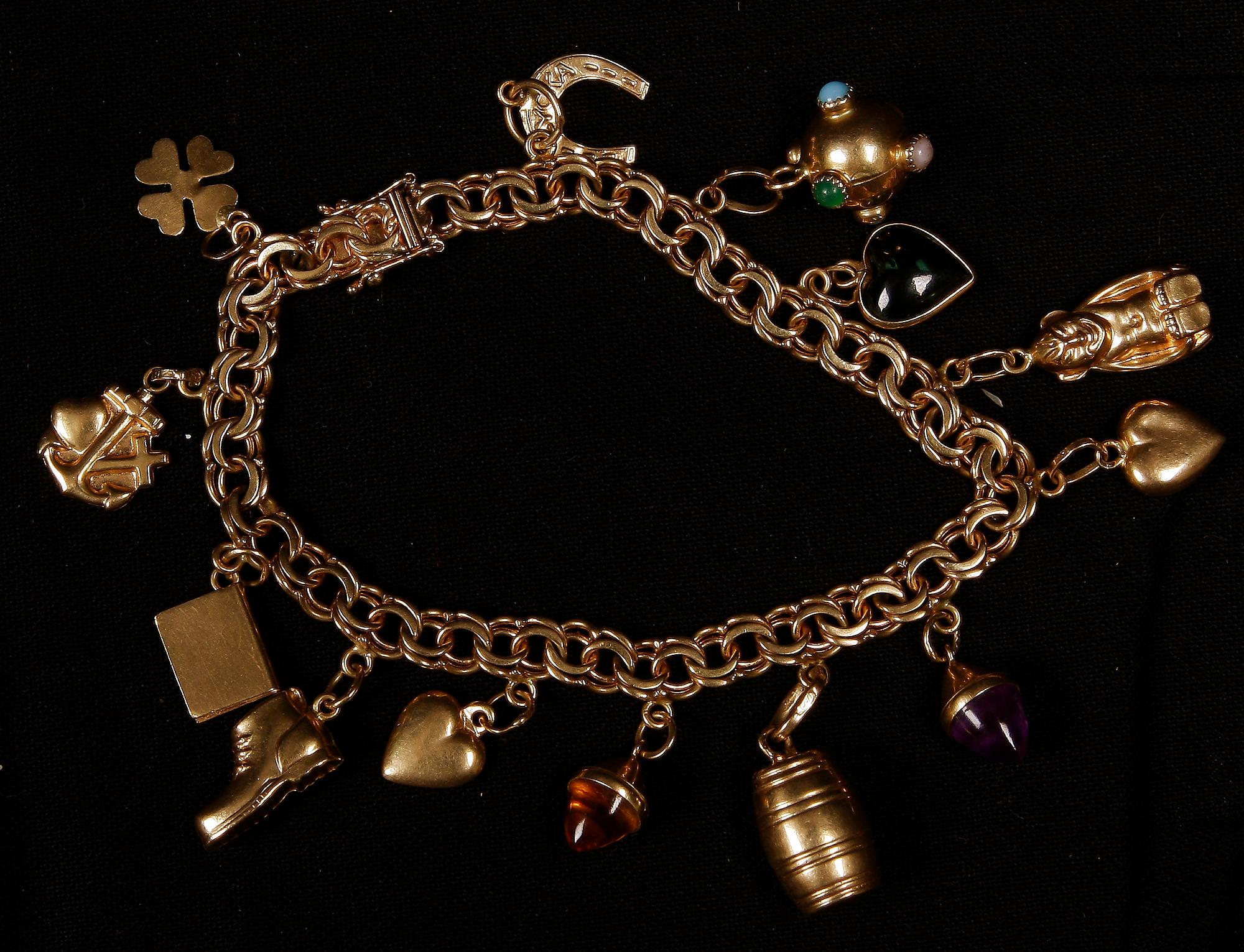 ARMBAND, 18 K guld samt halvädelstenar, Köping, 1967. Ca 22 g.