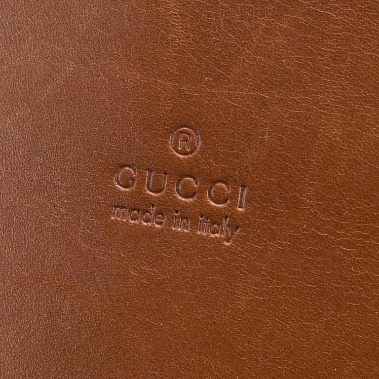 A bag, wallet and cardholder by Gucci.