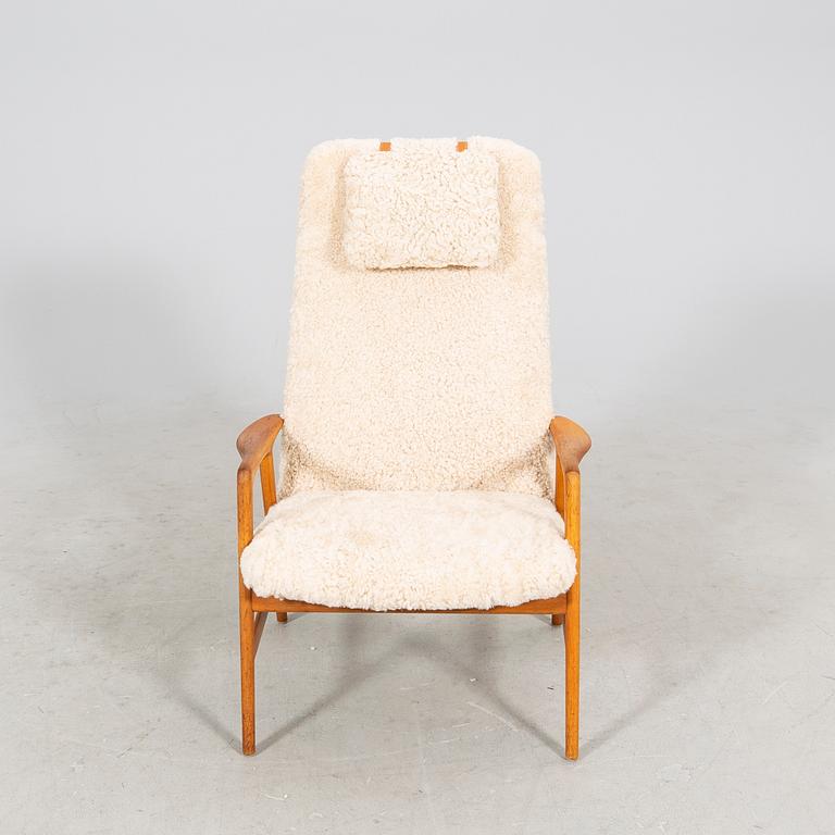 An Alf Svensson Contour-Set 327 sheepskin armchair.
