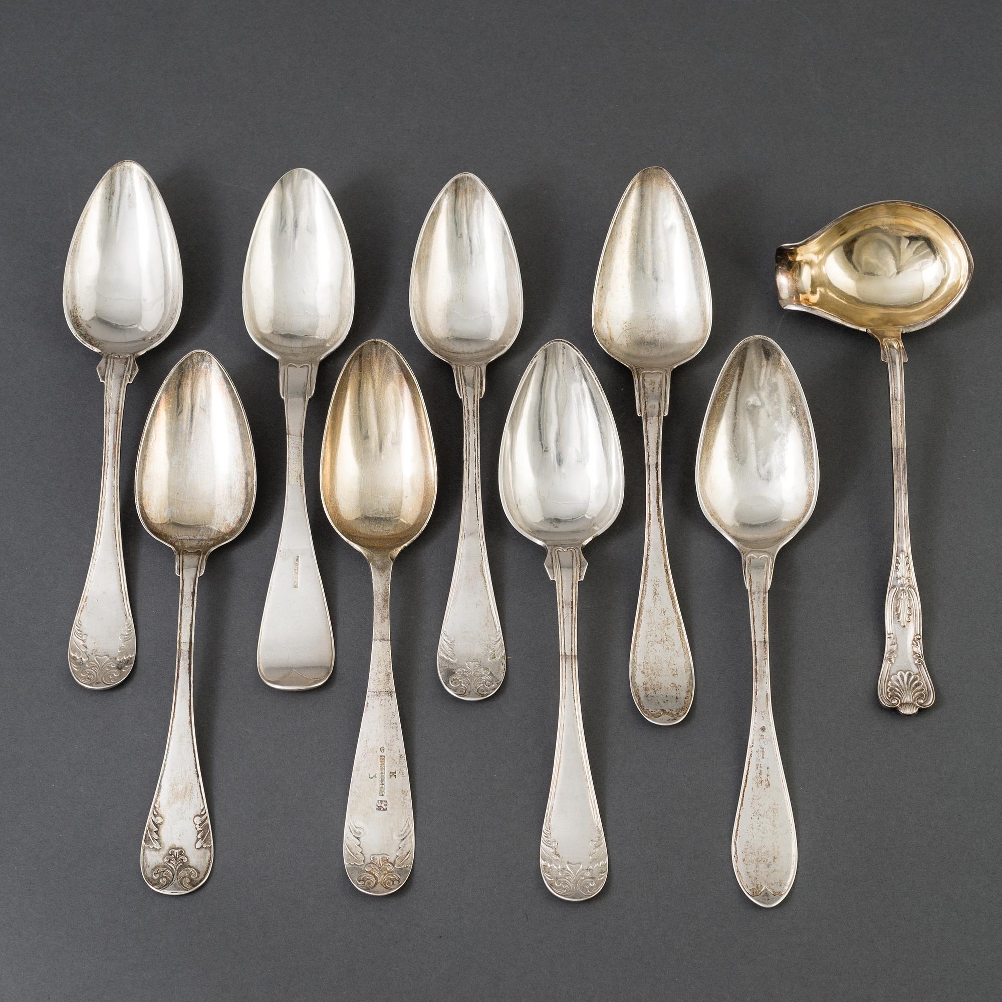 A lot of 8 silver spoons and a silver laddle, among others, P Holmberg, Orebro, 1844.