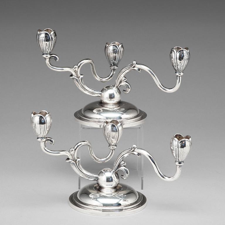 A pair of W.A. Bolin silver candelabra for three lights, Stockholm 1955.