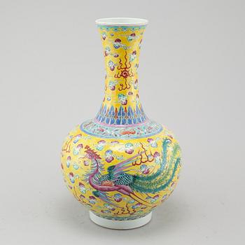 A yellow glazed dragon and phoenix vase, China, circa 1900.