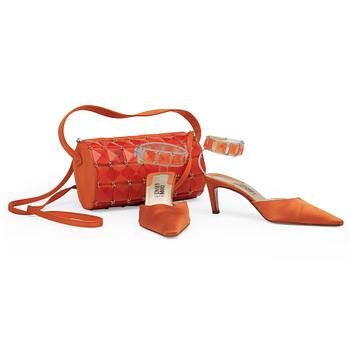 GIANNI VERSACE, a pair of orange lady's shoes and a handbag.