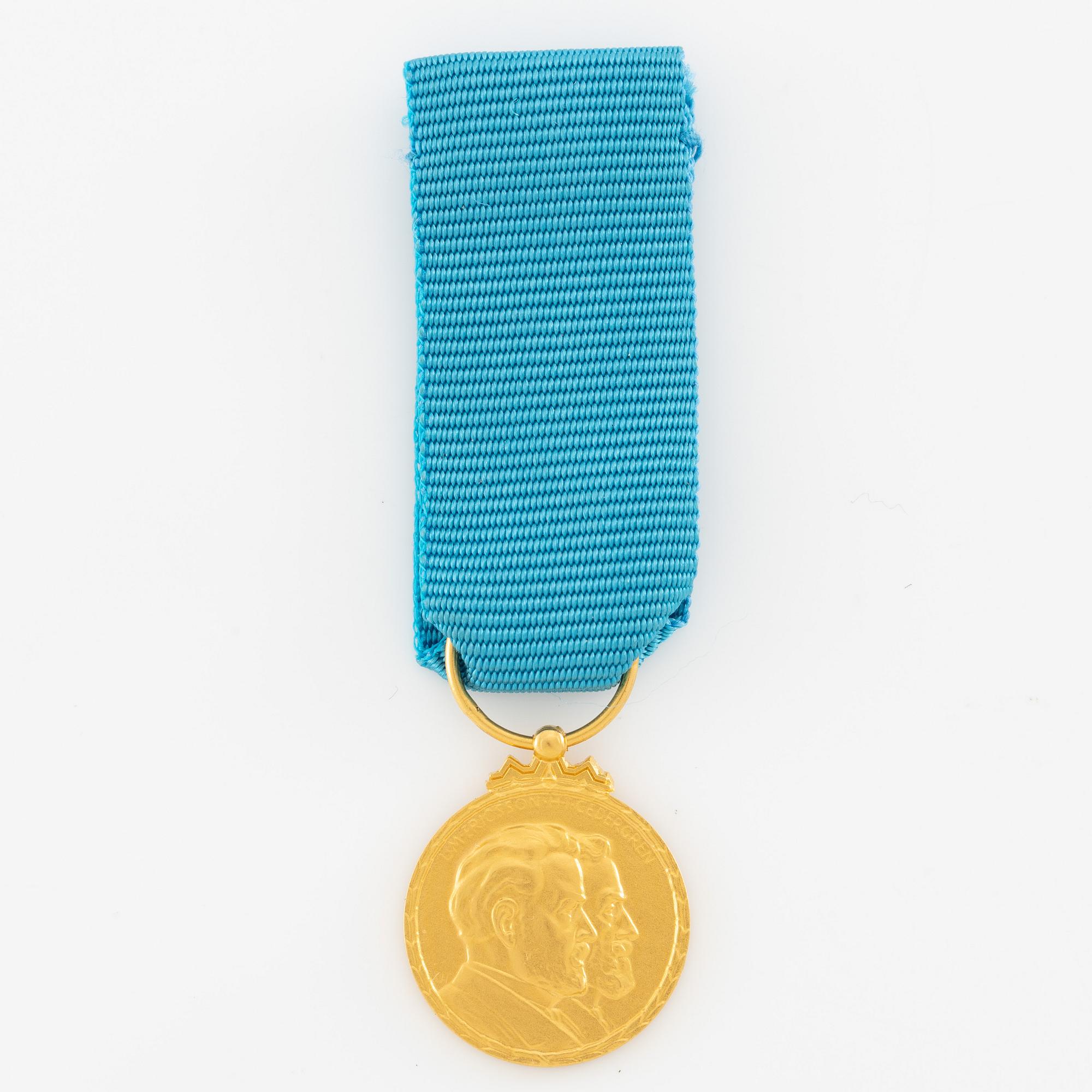 Medal, 14k gold, LM Ericsson, for merit and skill.