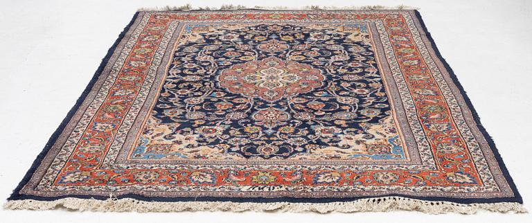 A Mashad carpet, signed, c. 289 x 198 cm.