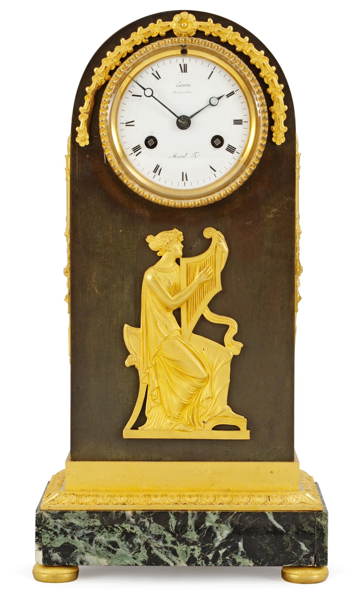 A French Empire mantel clock by A. A. Ravrio.