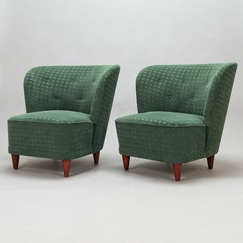 A pair of mid-20th-century armchairs.