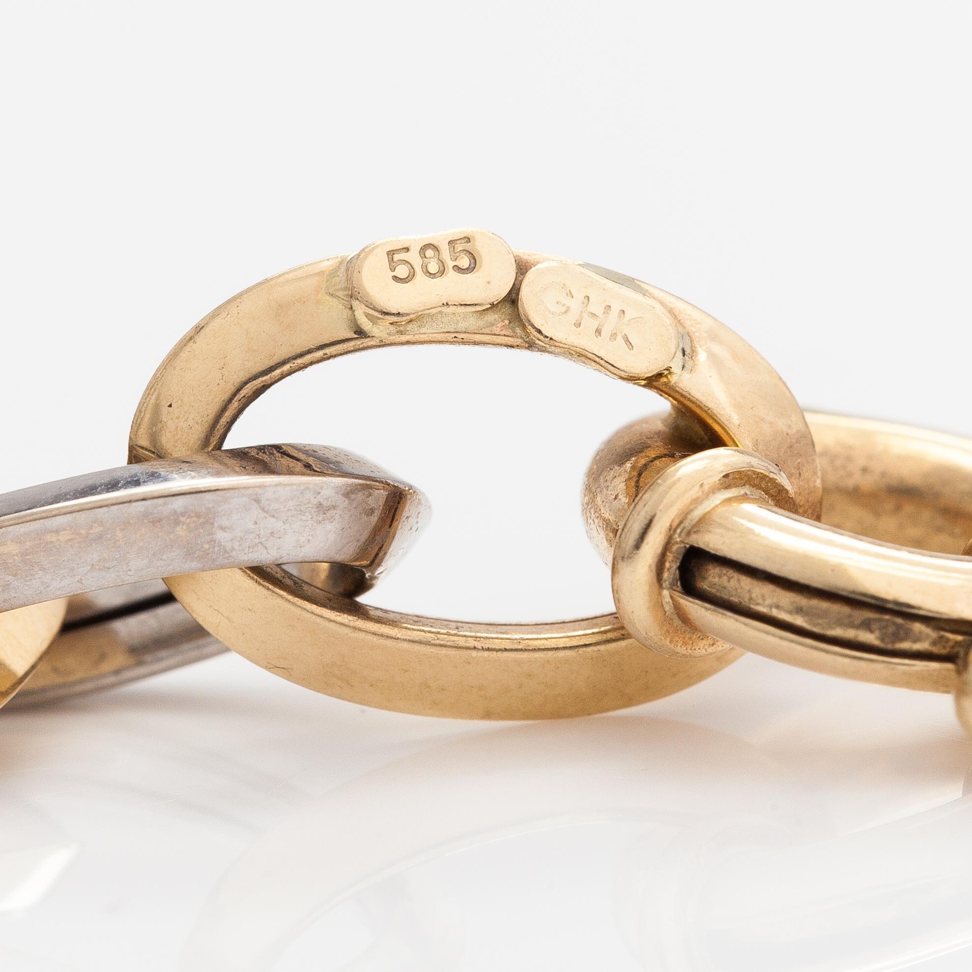 A 14K white and yellow gold necklace.