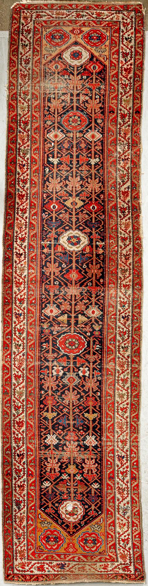 An antique Malajir runner ca 505x102 cm.