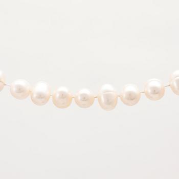 A cultured pearl necklace with a silver lock set with a round brilliant cut diamond.