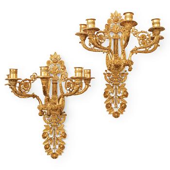 A pair of French 19th century gilt bronze five-light wall-lights.