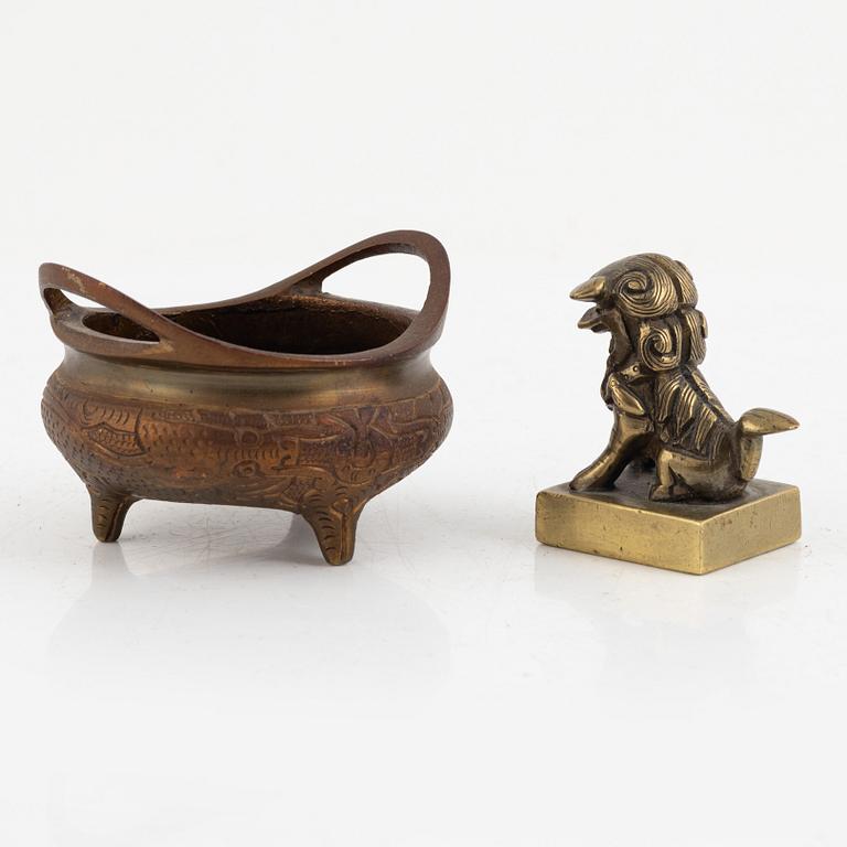 A Chinese bronze seal stamp and a tripod censer, late Qing dynasty, 19th century.