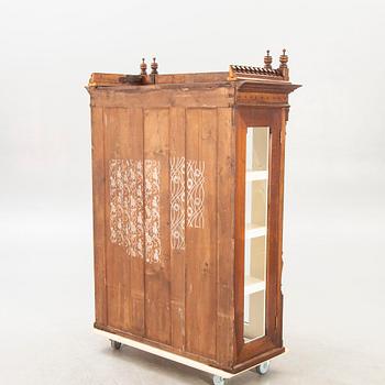 An early 1900s mahogany display cabinet.