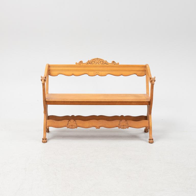 A carved oak sofa, circa 1900.